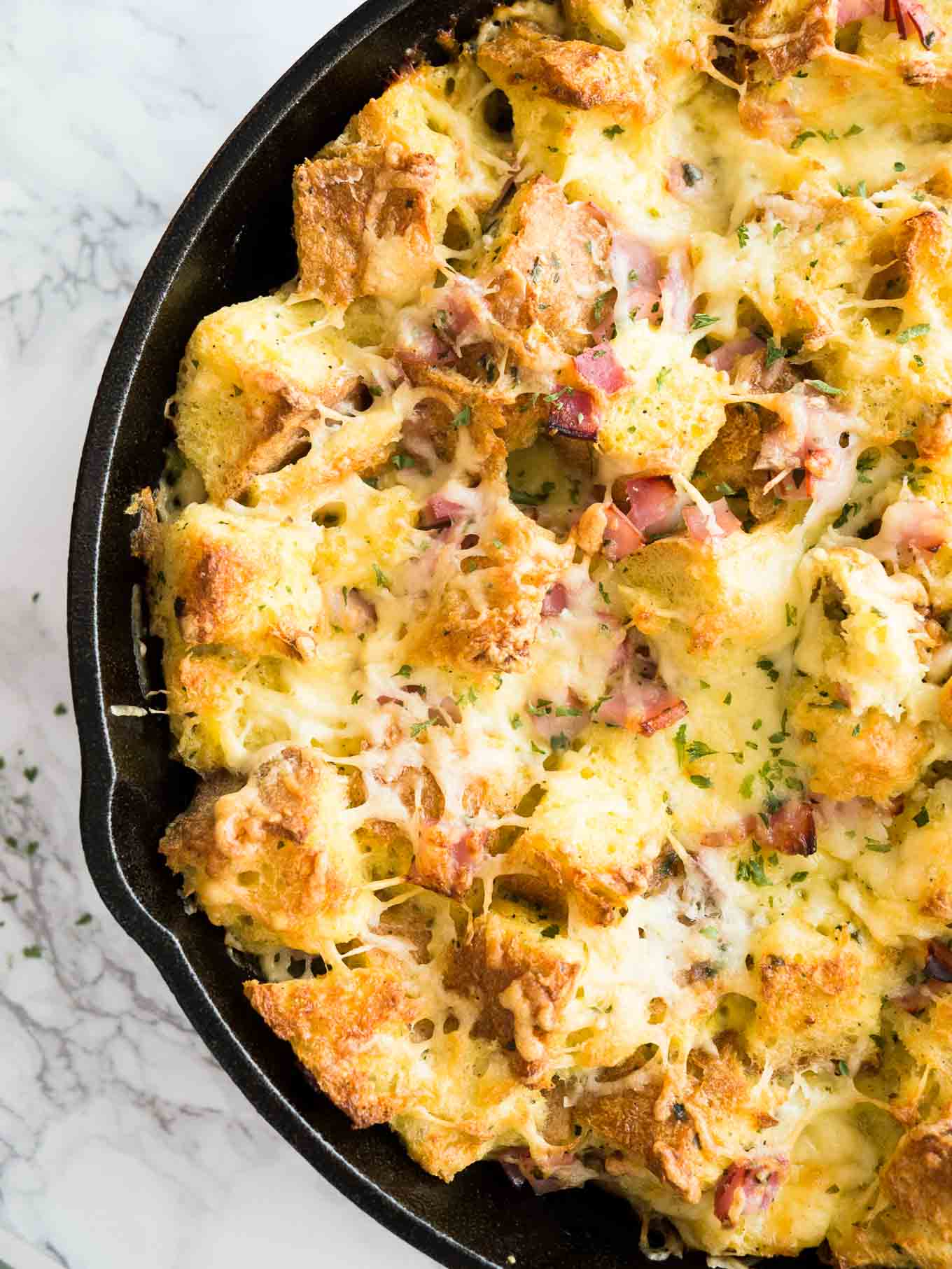 This Ham and Cheese Breakfast Casserole is the perfect dish to use leftovers! A delicious breakfast bake or strata made with bread, cheese, and ham that will become your family's favorite.