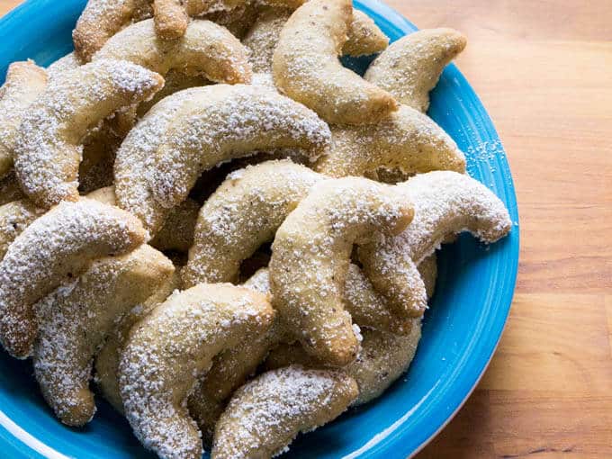 Vanillekipferl (German Vanilla Crescent Cookies) are traditional German Christmas Cookies made with ground hazelnuts or almonds! They are crispy and buttery and become even better after a few days.