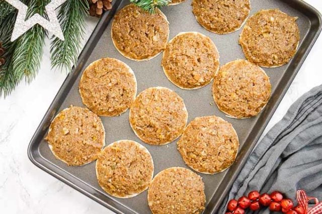 Twelve Lebkuchen on a backing sheet.