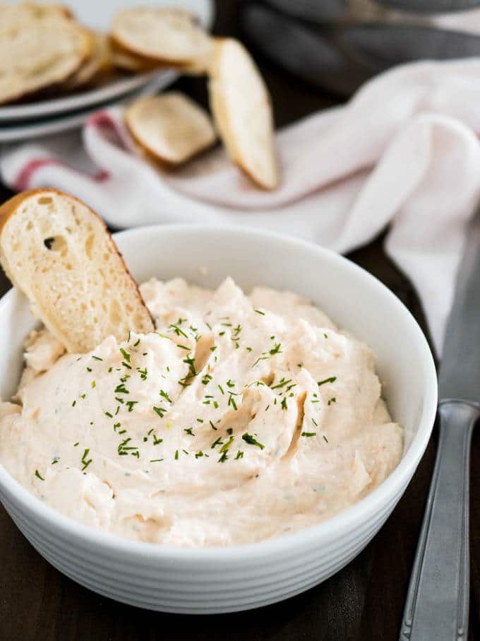This Smoked Salmon Dip Recipe is packed with flavors and super easy to make. Spread it on your favorite bread or serve as an appetizer with veggies and crackers. We make this dip at least once a week because we love it so much!