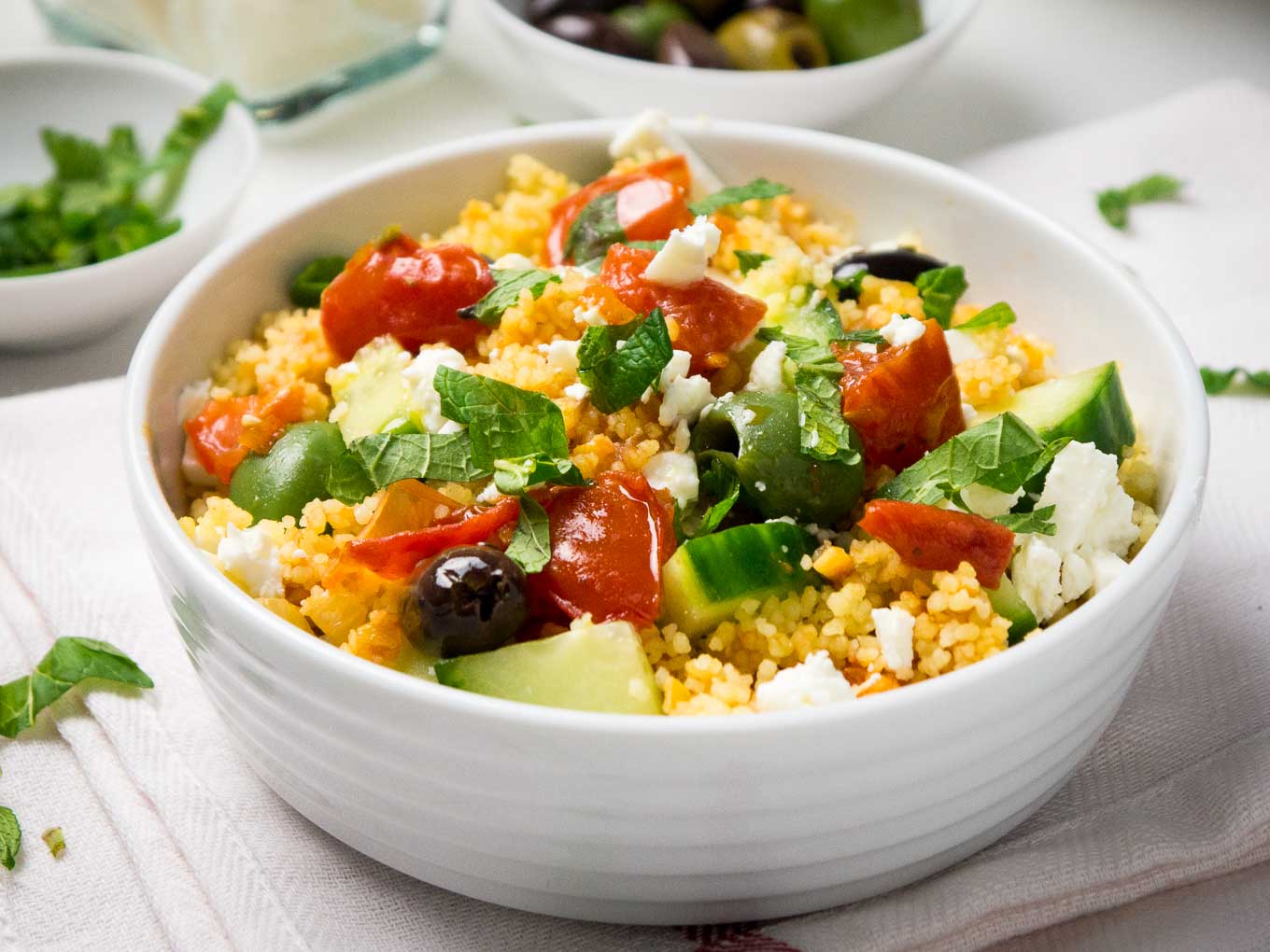 20-minute Greek Couscous Salad makes a great quick weeknight dinner but it's also perfect for parties! This easy recipe is sure to be a crowd-pleaser.