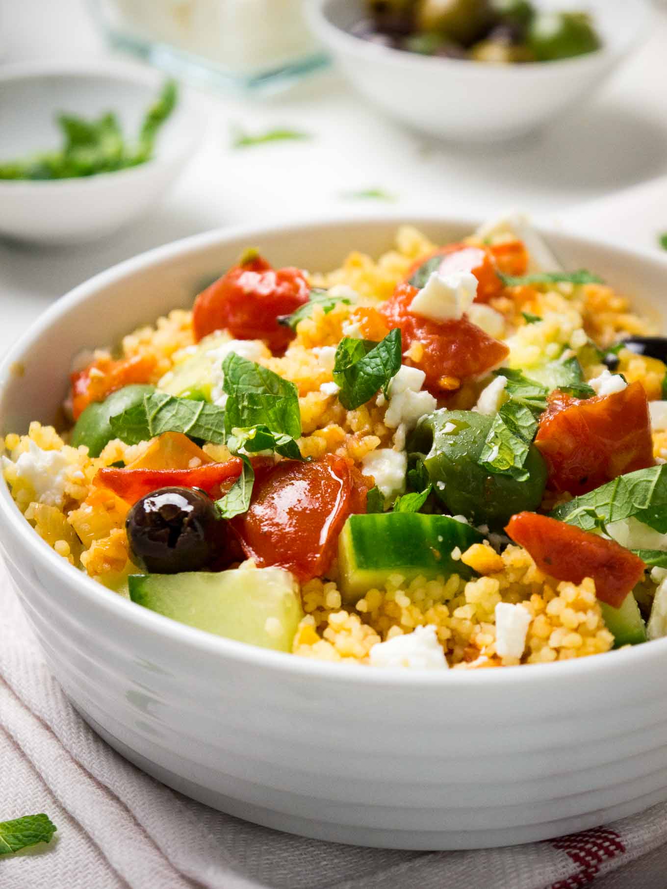 20-minute Greek Couscous Salad makes a great quick weeknight dinner but it's also perfect for parties! This easy recipe is sure to be a crowd-pleaser.