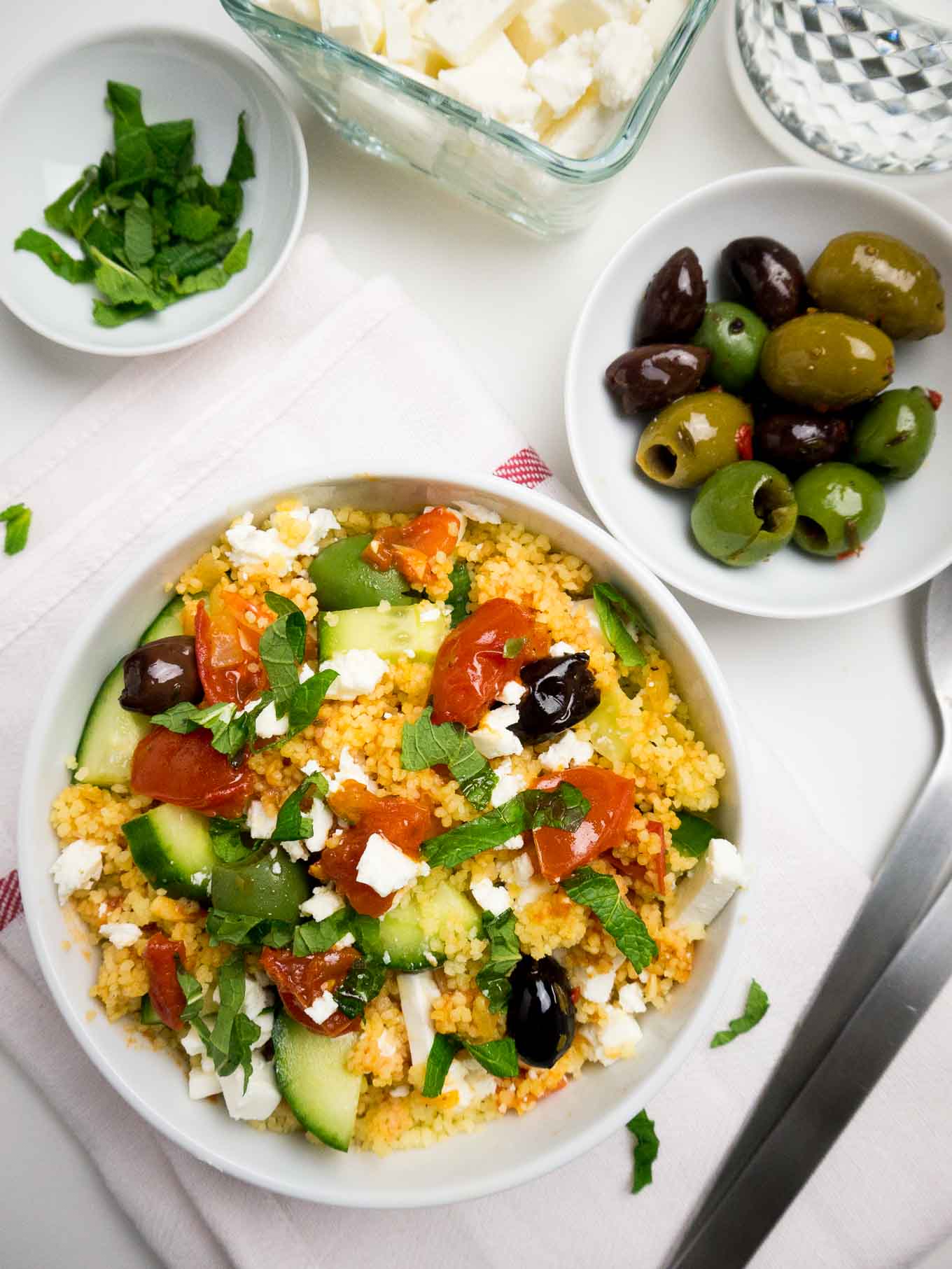 20-minute Greek Couscous Salad makes a great quick weeknight dinner but it's also perfect for parties! This easy recipe is sure to be a crowd-pleaser.