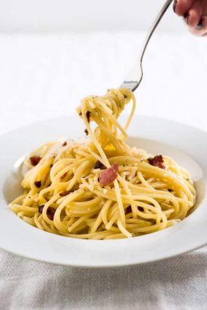 This 15-minute Spaghetti alla Carbonara is the perfect weeknight dinner! It's so fast to make and tastes so rich and creamy - but without using cream.