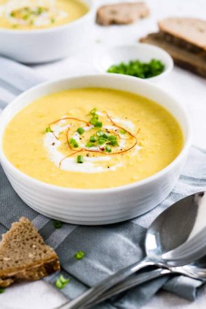 This Curried Cream of Corn Soup is creamy, a little bit spicy, and full of flavor! It makes a great weeknight meal - 15 minutes and you have a delicious meal. Serve with baguette or pita bread!