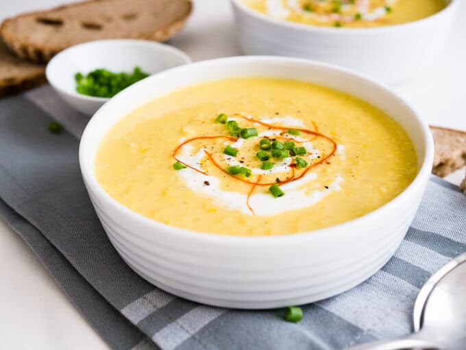 This Curried Cream of Corn Soup is creamy, a little bit spicy, and full of flavor! It makes a great weeknight meal - 15 minutes and you have a delicious meal. Serve with baguette or pita bread!