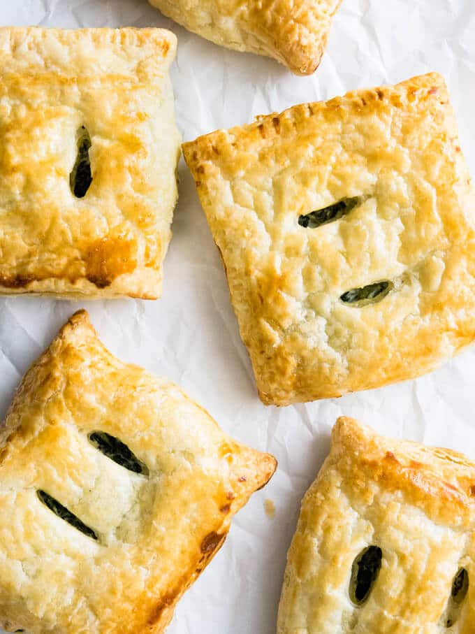 These Spinach Ricotta Puff Pastry Parcels are easy to make and can be prepared in advance. Much less fuss than filo pastry and perfect as a snack!