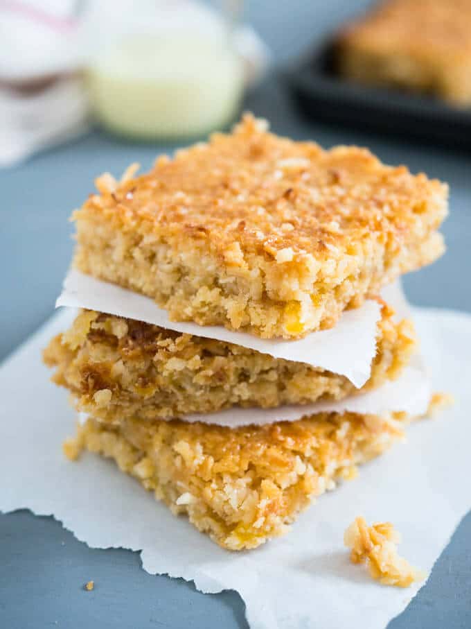 Tropical Coconut Squares taste like candy bars! Three delicious layers topped with sweetened condensed milk make this dessert a naughty little treat.
