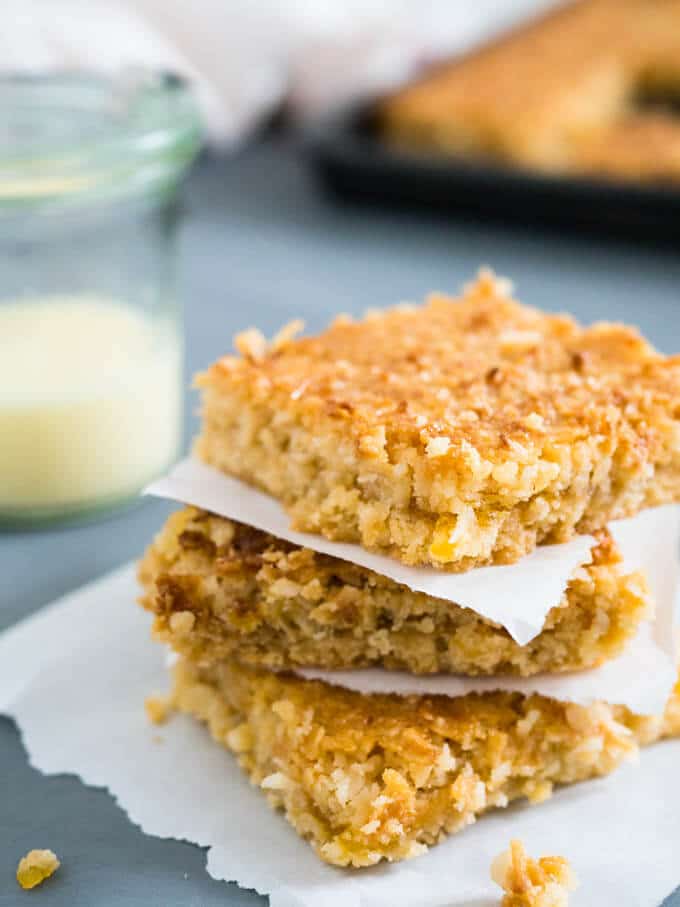 Tropical Coconut Squares taste like candy bars! Three delicious layers topped with sweetened condensed milk make this dessert a naughty little treat.