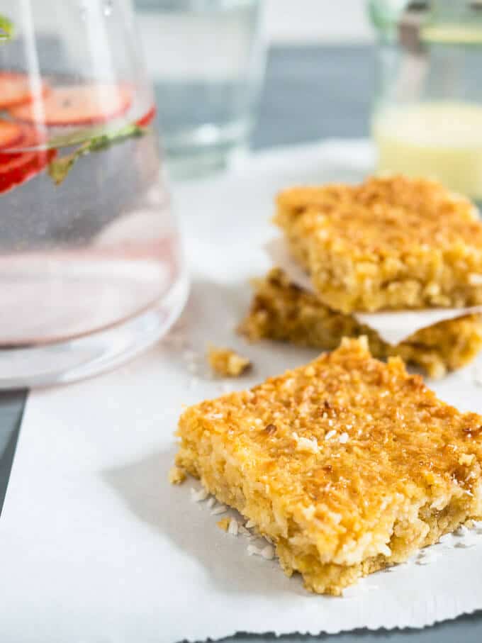 Tropical Coconut Squares taste like candy bars! Three delicious layers topped with sweetened condensed milk make this dessert a naughty little treat.