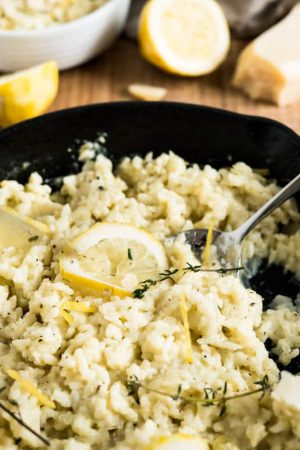 Creamy Lemon Risotto is a perfect summer dish made with parmesan, rosemary, and fresh lemons. Comfort food for sunny days or whenever you need a little bit sunshine in your life!