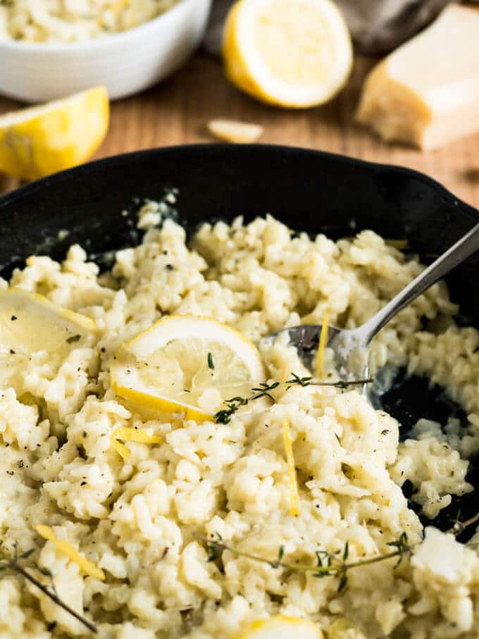 Creamy Lemon Risotto is a perfect summer dish made with parmesan, rosemary, and fresh lemons. Comfort food for sunny days or whenever you need a little bit sunshine in your life!
