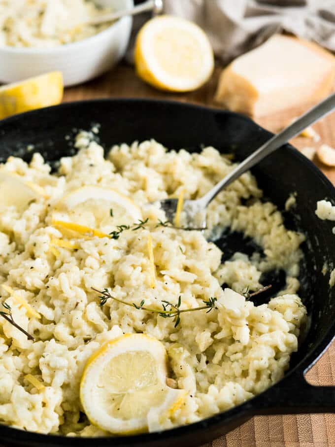 Creamy Lemon Risotto is a perfect summer dish made with parmesan, rosemary, and fresh lemons. Comfort food for sunny days or whenever you need a little bit sunshine in your life!