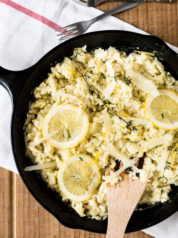 Creamy Lemon Risotto is a perfect summer dish made with parmesan, rosemary, and fresh lemons. Comfort food for sunny days or whenever you need a little bit sunshine in your life!