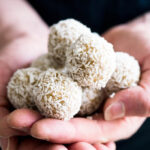 Coconut Date Balls are a great healthy treat! They are made with shredded coconut, cashew butter, and dates. If you're a fan of Raffaello Candy or other coconut treats then you will love these little bites.