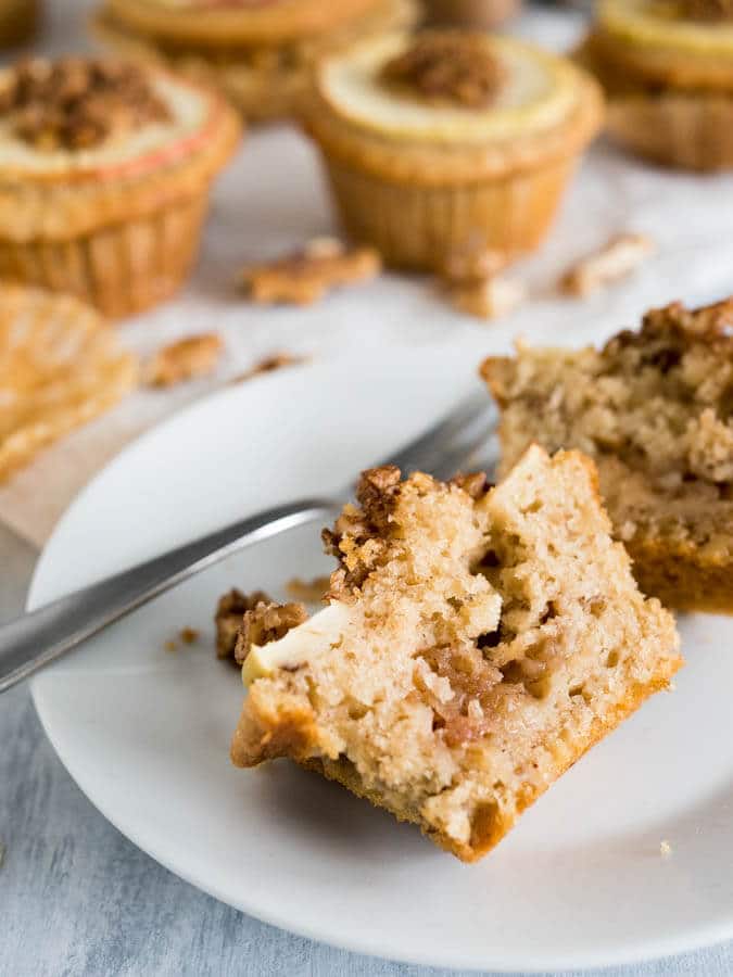 Apple Cinnamon Muffins are made with brown butter and topped with caramelized walnuts! They have a secret filling which makes them extra moist and delicious. 