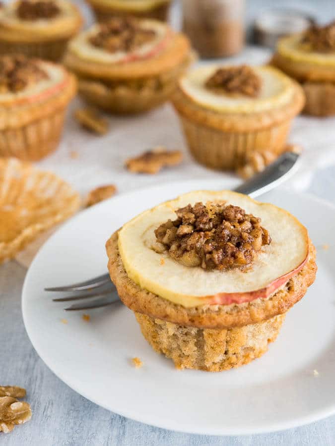 Apple Cinnamon Muffins are made with brown butter and topped with caramelized walnuts! They have a secret filling which makes them extra moist and delicious. 