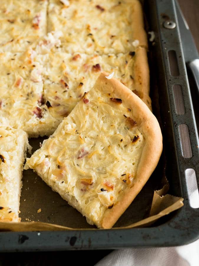 This Onion Tart is made with bacon and a really big amount of onions! It tastes best lukewarm with a glass of wine or some freshly squeezed grape juice. A perfect fall appetizer or snack!