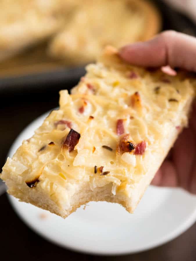 This Onion Tart is made with bacon and a really big amount of onions! It tastes best lukewarm with a glass of wine or some freshly squeezed grape juice. A perfect fall appetizer or snack!