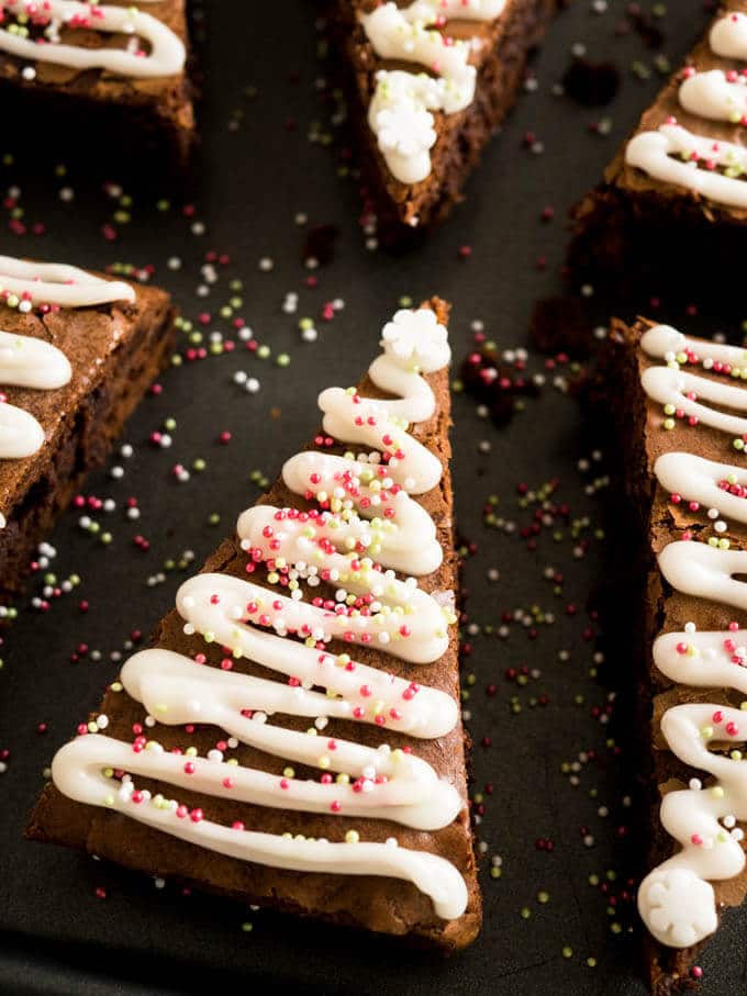 These Gingerbread Christmas Brownies take just minutes to put together! Add a seasonal spin to classic fudgy brownies with an easy semi-from-scratch recipe for Christmas Tree Brownies made with gingerbread spice and decorated with lots of sprinkles.