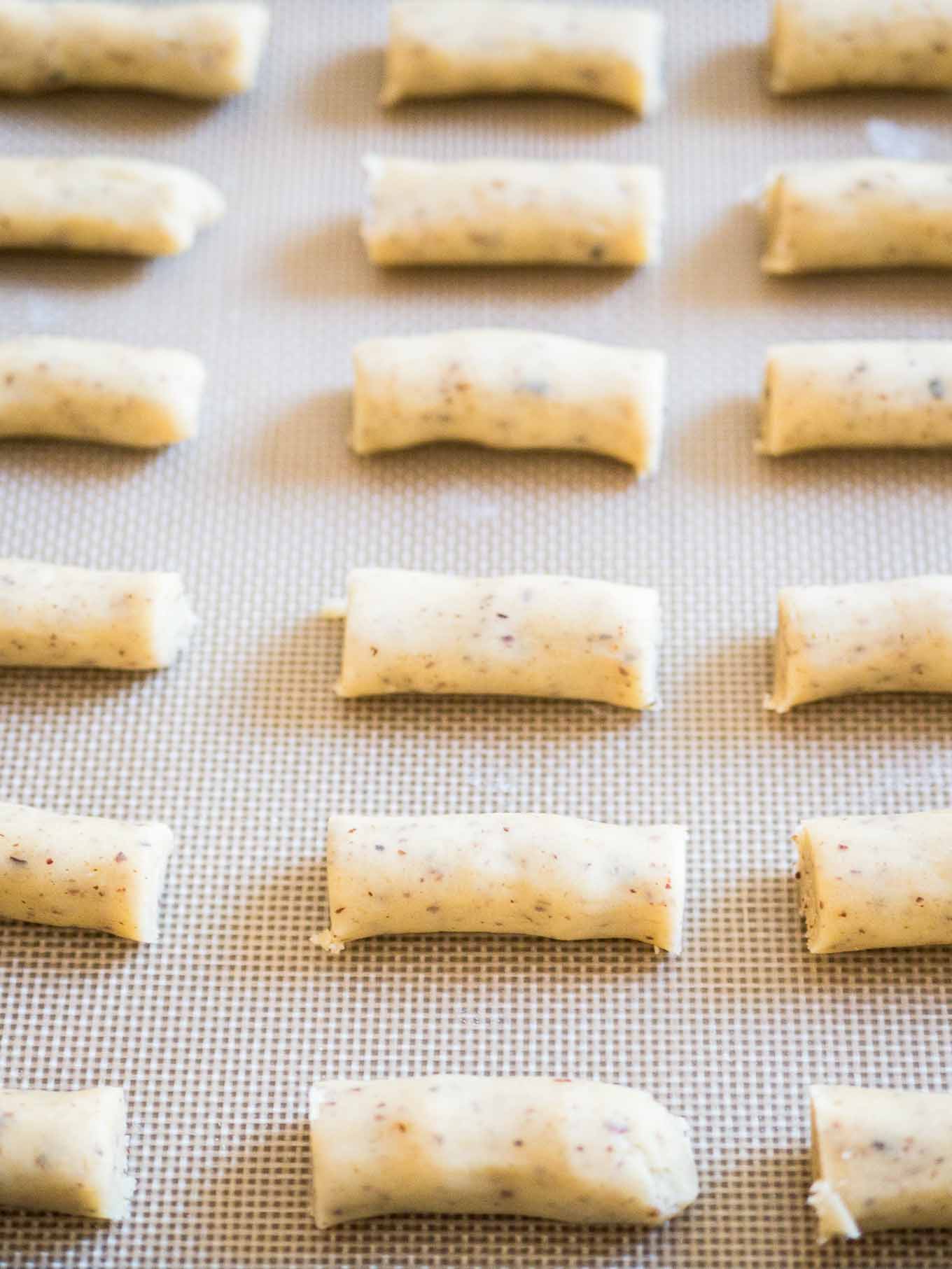 Raw cookie dough on a baking sheet.