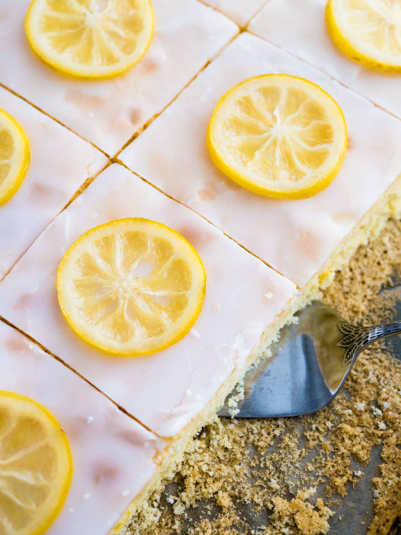 An easy lemon sheet cake recipe that is made in a 9x13-inch pan and has a delicious simple lemon glaze on top. This lemon cake tastes even better on the next day!