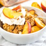 Peach Crisp is made with fresh peaches and topped with a crunchy oatmeal brown sugar streusel! This easy summer dessert is the ultimate comfort food.