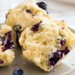 Easy Blueberry Muffins are super quick and simple to make from scratch! These bakery style muffins are bursting with fresh blueberries and are perfect for breakfast or brunch.