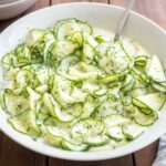 German Cucumber Salad is a refreshing summer salad made with simple ingredients that are a staple in most kitchens! This easy recipe is easy to make, budget-friendly, and perfect for a potluck, family dinner, or summer cookout.