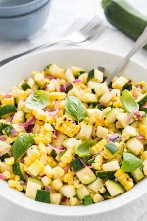 Roasted Corn Zucchini Salad is an easy but so flavorful vegetable side dish made with fresh corn, zucchini, and onions. A delicious summer salad that will dress up every meal.