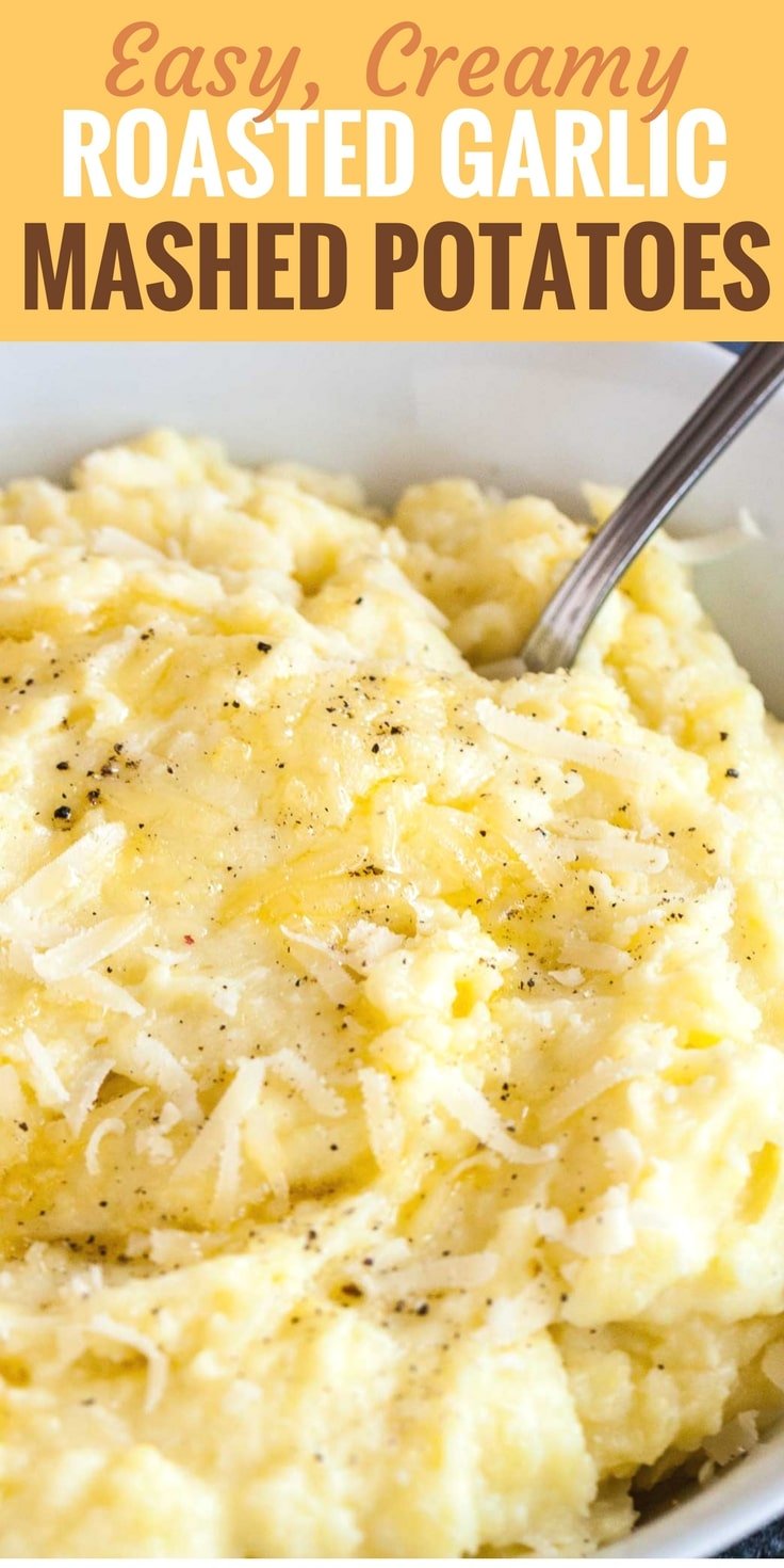 Image with text: Eay, creamy roasted garlic mashed potatoes. image: Close-up of a white bowl of roasted garlic mashed potatoes topped with Parmigiano cheese and pepper with a spoon in it. There\'s a white and blue dishtowel in the background.