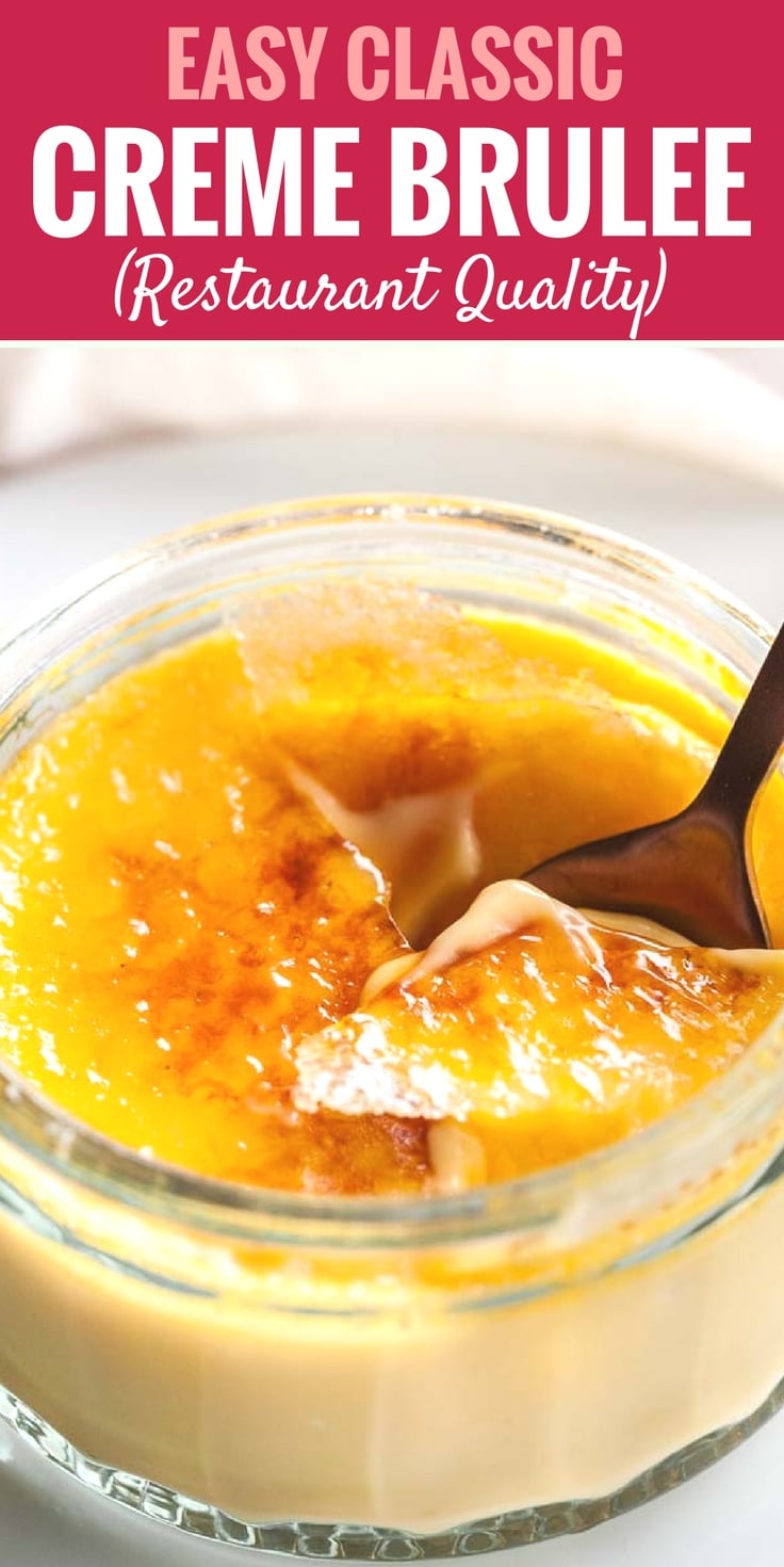 Close-up of a glass of creme brulee with a bronze spoon cracking its top on a white plate in front of a white dishtowel.