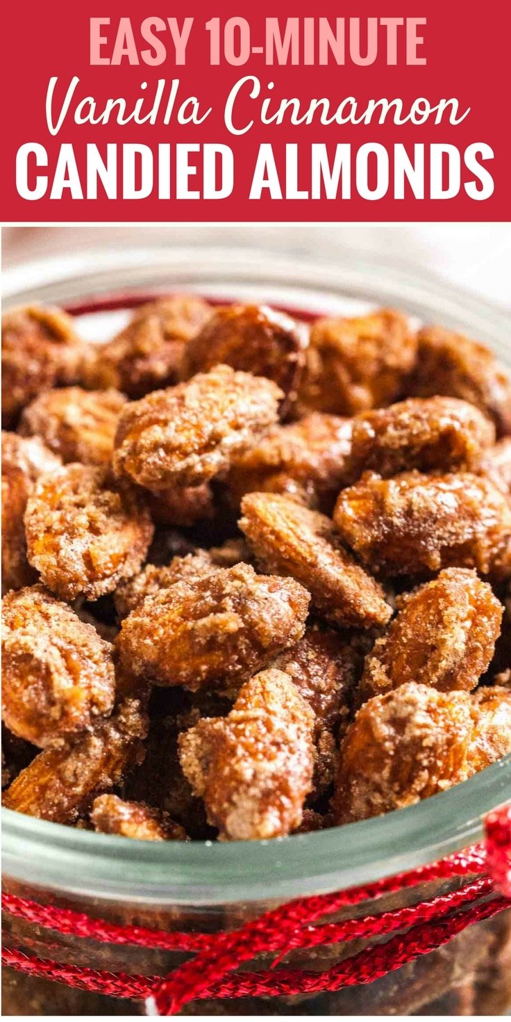 Close-up of a glass bowl of cinnamon candied almonds.