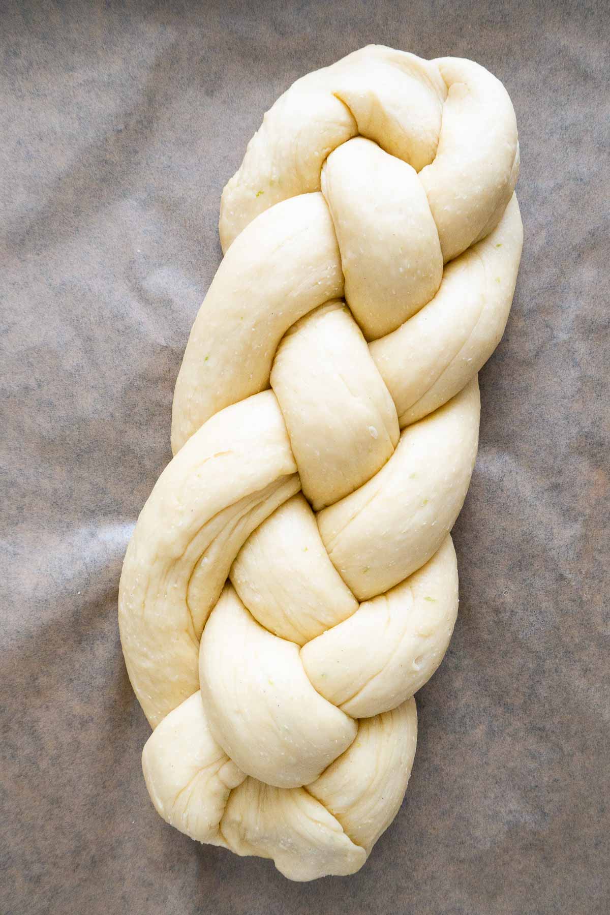 A Hefezopf before baking on parchment paper.
