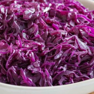 Close-up of red cabbage on a white serving plate.