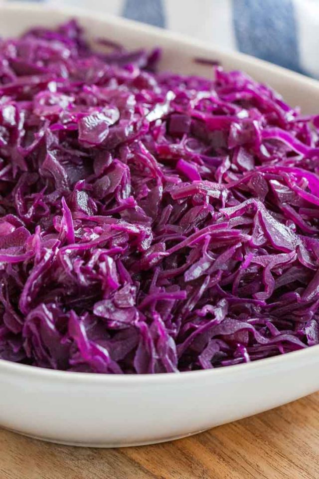 Close-up of red cabbage on a white serving plate.