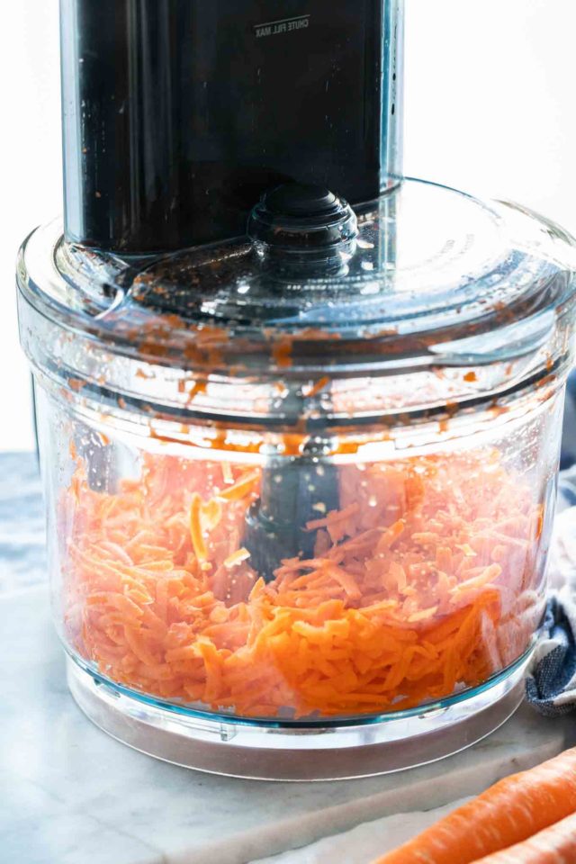 shredded carrots in a food processor