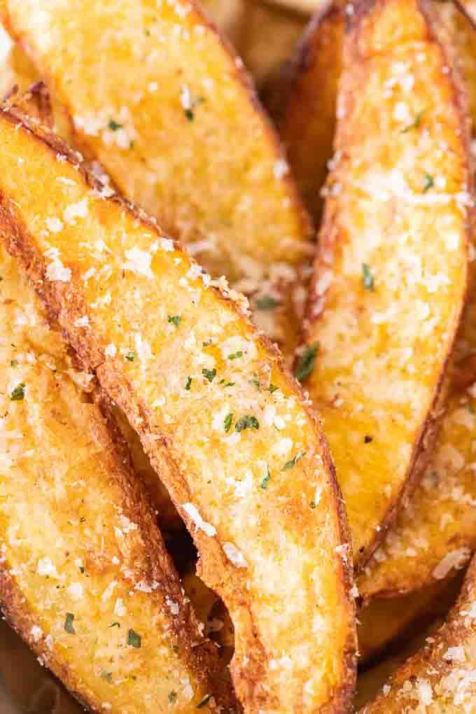 Close-up of Air Fryer Potato Wedges, garnished with Parmigiano