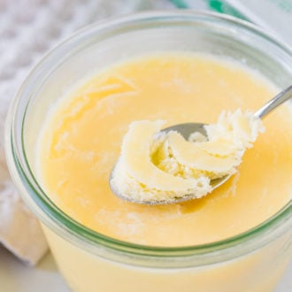 Clarified Butter in a glass jar, with a spoon