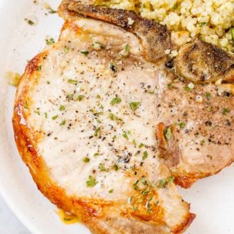 A plate of food, with Pork chop
