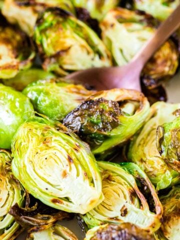 Close up of roasted Air Fryer Brussels Sprouts with a spoon