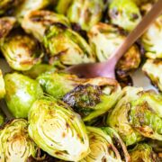 Close up of roasted Air Fryer Brussels Sprouts with a spoon