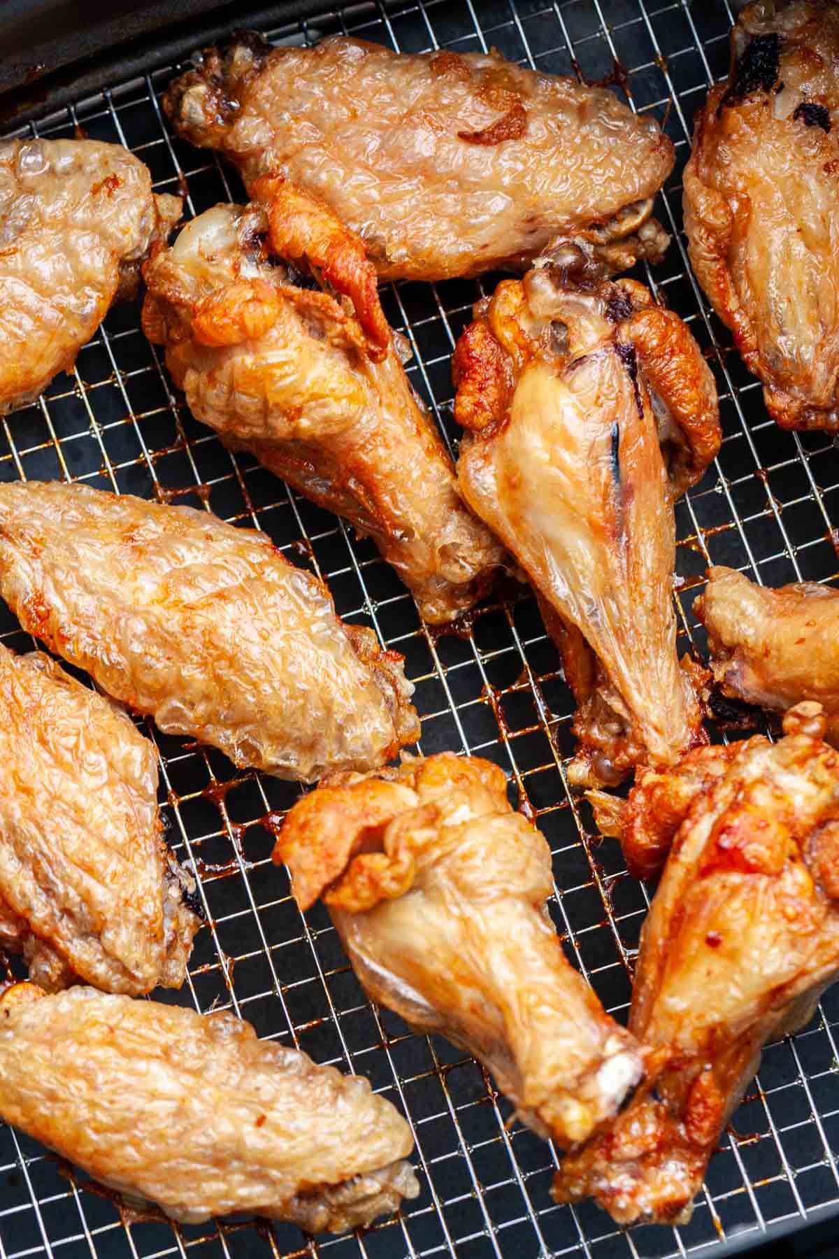 Air-fried chicken wings in an Air Fryer basket.