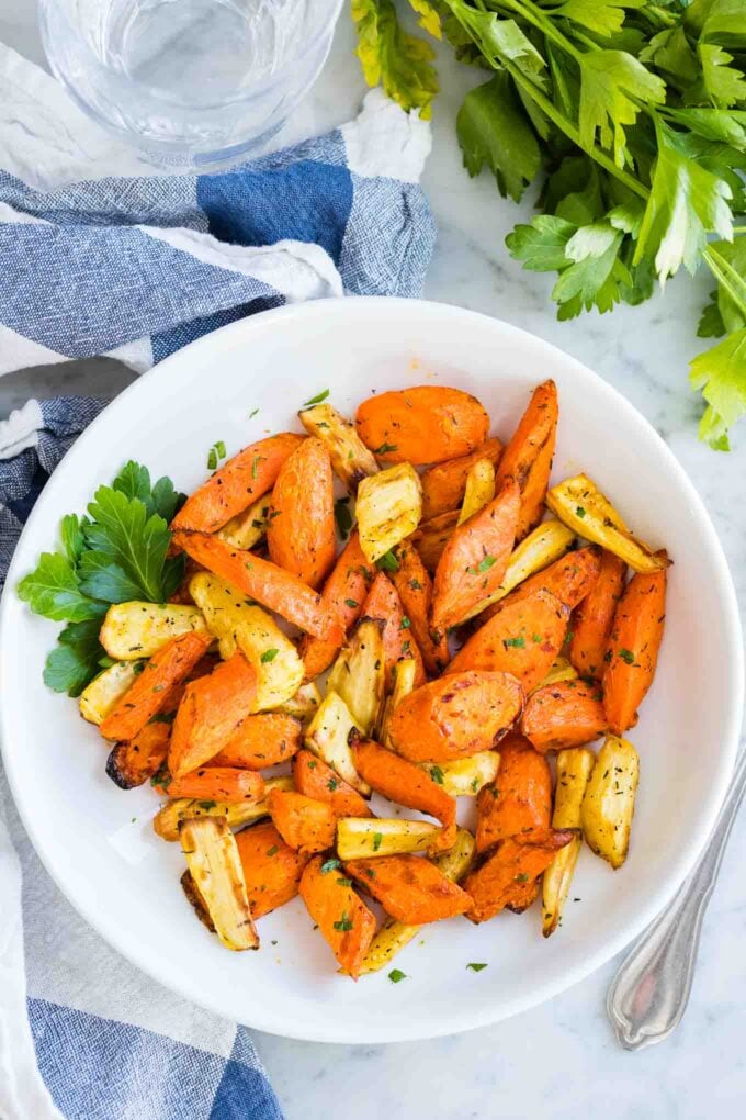 Roasted Carrots on a plate sprinkled with parsley
