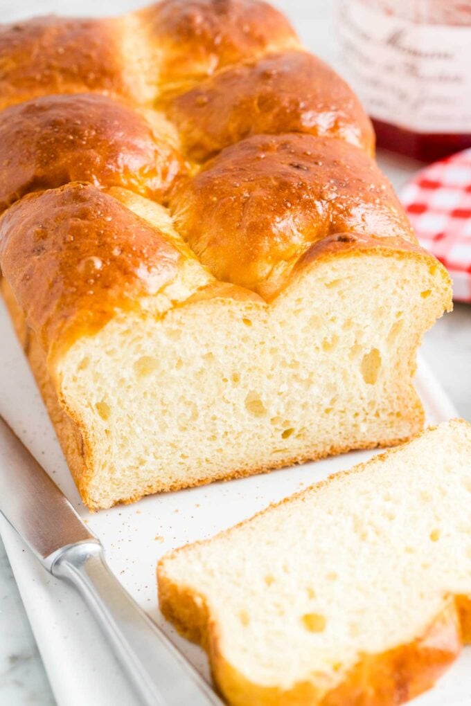 A loaf of Brioche bread on a serving tray