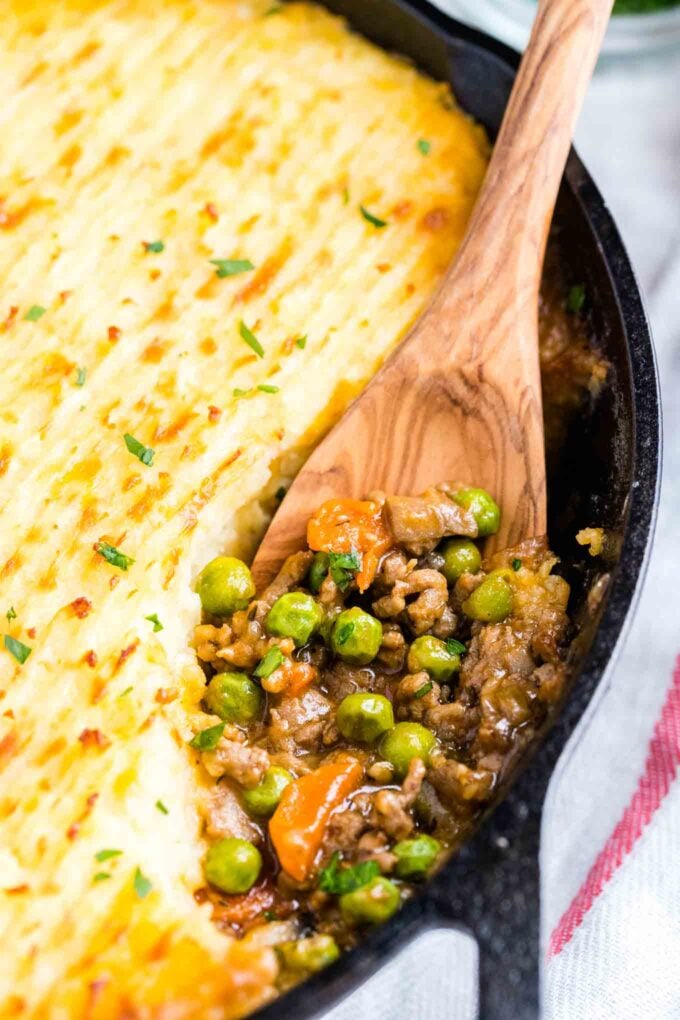 Shepherd's Pie in a pan with a wooden spoon in it