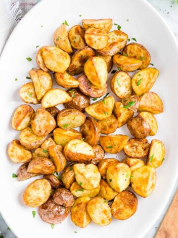 Roasted potatoes on a serving plate