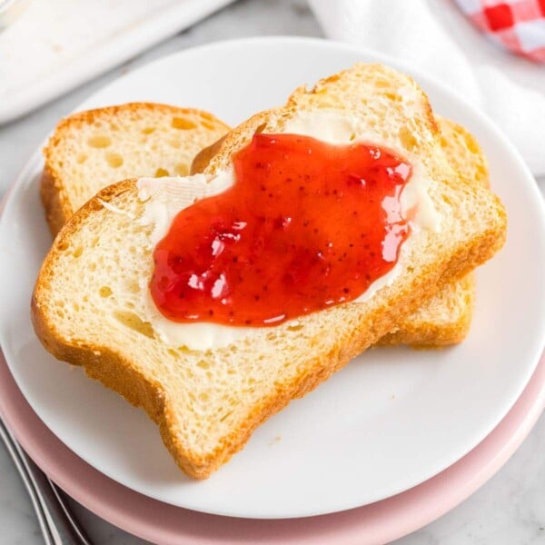 Sliced Brioche Bread on a plate with jam