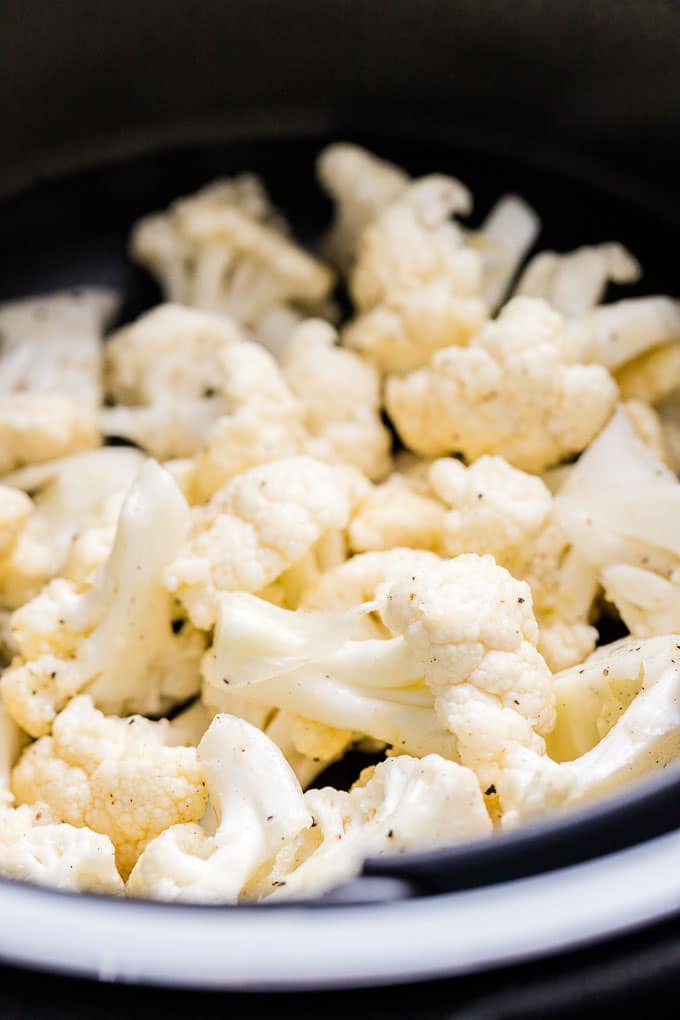 Raw Cauliflower in the Air Fryer Basket