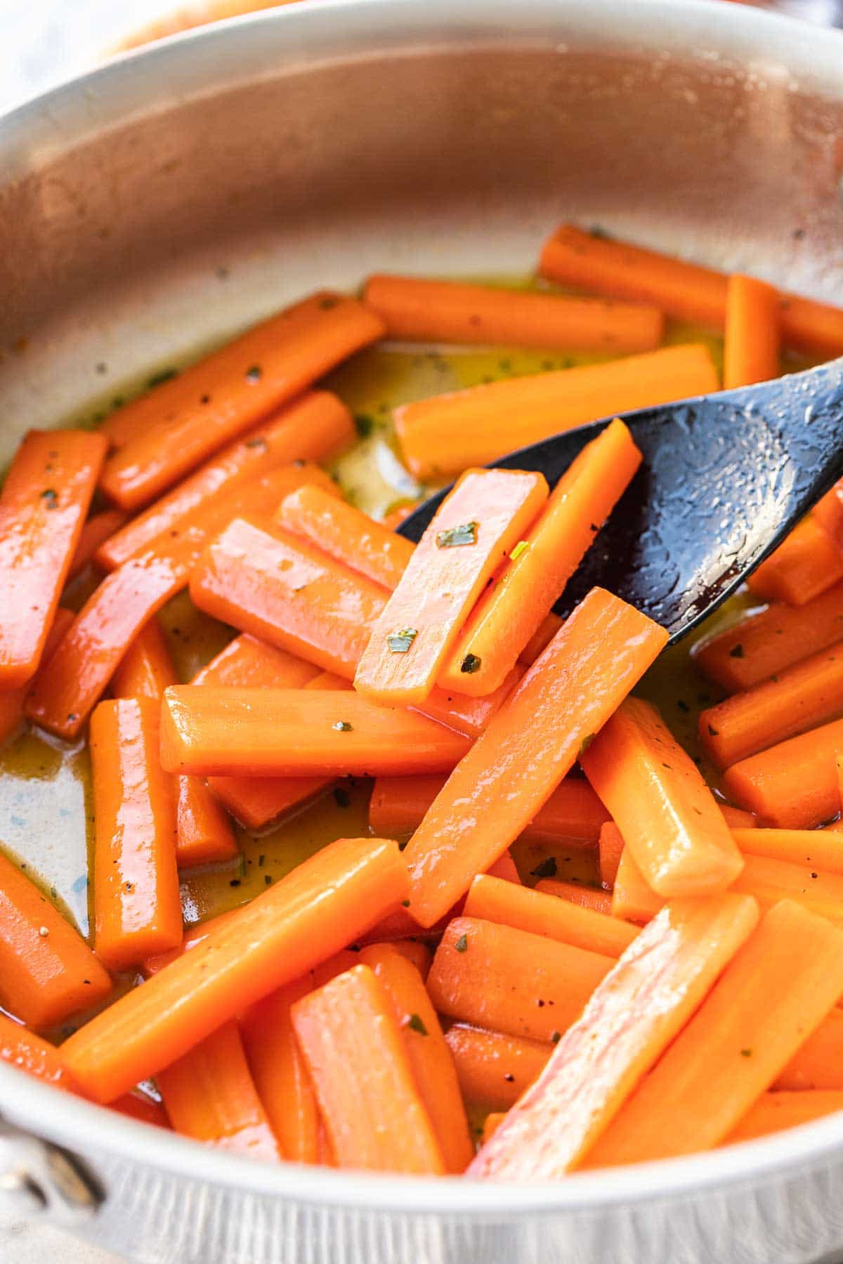 Carrots in a large skillet glazed with honey